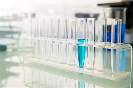 solution (mixture of substances) - Rack of test tubes with solution on counter in lab Stock Photo - Premium Royalty-Free, Code: 6113-07790354