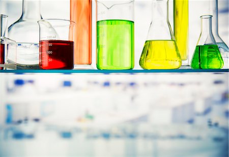 simsearch:632-03516577,k - Close up of beakers with solution on shelf in lab Stock Photo - Premium Royalty-Free, Code: 6113-07790360