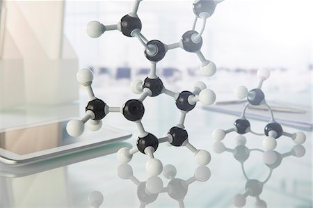 Molecular model and digital tablet on counter in lab Stock Photo - Premium Royalty-Free, Code: 6113-07790364