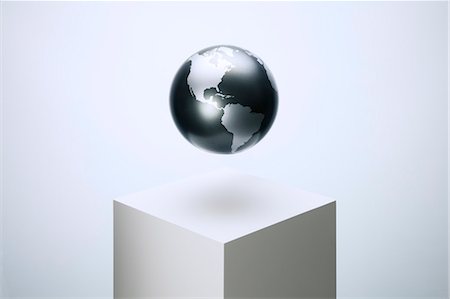 pedestal - Globe hovering over pedestal Foto de stock - Sin royalties Premium, Código: 6113-07790389