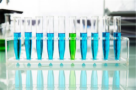 solution (mixture of substances) - Rack of test tubes with solution on counter in lab Stock Photo - Premium Royalty-Free, Code: 6113-07790332