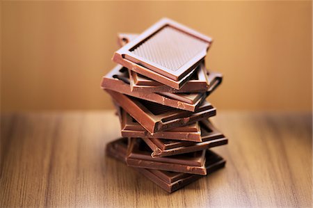 partially eaten - Close up of stack of chocolate squares Stock Photo - Premium Royalty-Free, Code: 6113-07790452