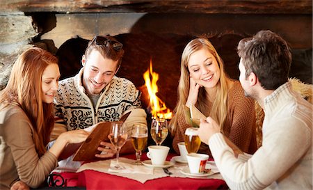 restuarants - Friends ordering food at restaurant Stock Photo - Premium Royalty-Free, Code: 6113-07790582