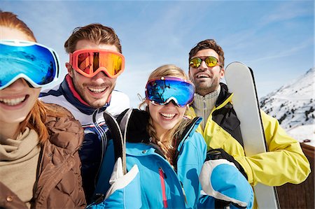 skiing man - Friends carrying skis on mountain top Stock Photo - Premium Royalty-Free, Code: 6113-07790623