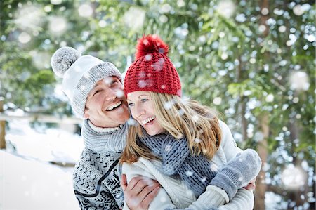 snowing - Couple playing in snow together Stock Photo - Premium Royalty-Free, Code: 6113-07790620