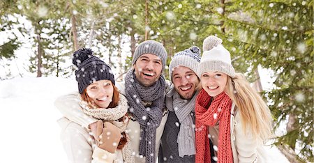 snow couple smiling hugging - Friends hugging in the snow Stock Photo - Premium Royalty-Free, Code: 6113-07790700