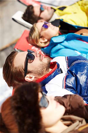 sunbath on snow - Friends relaxing in snow Stock Photo - Premium Royalty-Free, Code: 6113-07790712