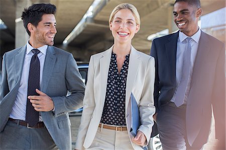 Business people walking together Stock Photo - Premium Royalty-Free, Code: 6113-07790893