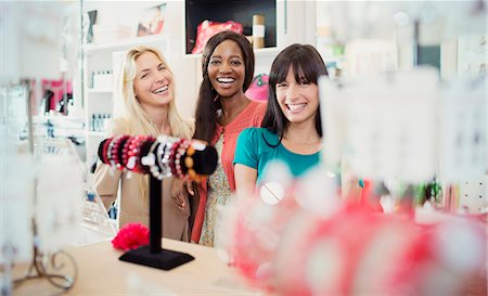 shopping and laughing and funny - Women shopping together in store Stock Photo - Premium Royalty-Free, Code: 6113-07791018