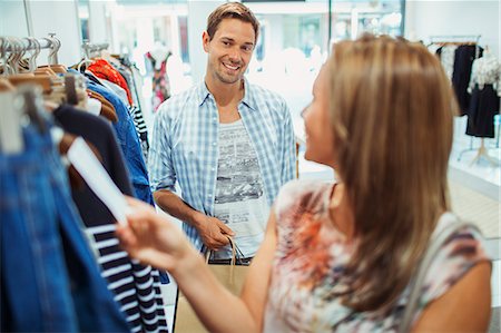 Couple shopping together in clothing store Photographie de stock - Premium Libres de Droits, Code: 6113-07791027