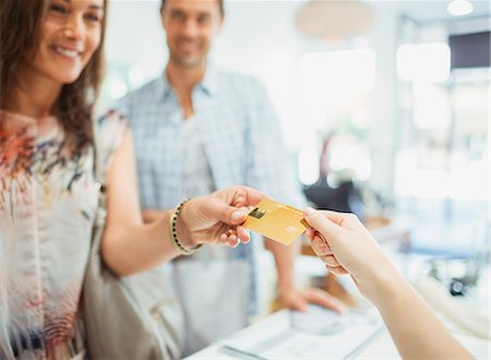 simsearch:6113-07565610,k - Close up of woman paying with credit card in store Stock Photo - Premium Royalty-Free, Code: 6113-07791028