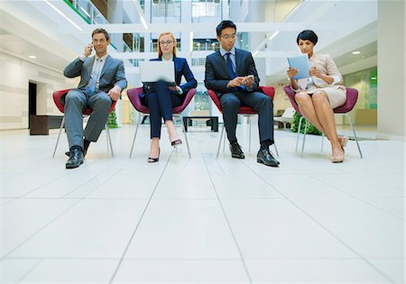 east asian ethnicity - Business people sat in chairs working in office building Stock Photo - Premium Royalty-Free, Code: 6113-07791274