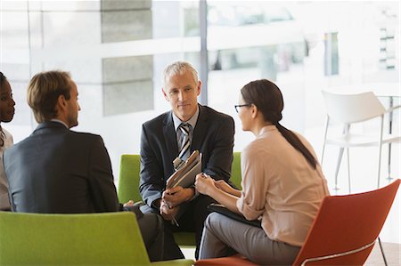 simsearch:6113-07731371,k - Business people having meeting in office building Stock Photo - Premium Royalty-Free, Code: 6113-07791298