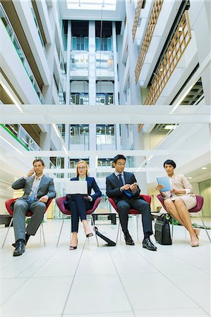 simsearch:6113-07791320,k - Business people sitting in office building Stock Photo - Premium Royalty-Free, Code: 6113-07791336