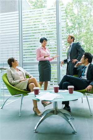 Business people talking in office building Stock Photo - Premium Royalty-Free, Code: 6113-07791448