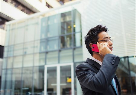 simsearch:6113-07791454,k - Businessman talking on cell phone outside of office building Photographie de stock - Premium Libres de Droits, Code: 6113-07791450