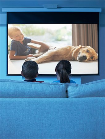 family watching tv from back - Children watching television in living room Stock Photo - Premium Royalty-Free, Code: 6113-07730550