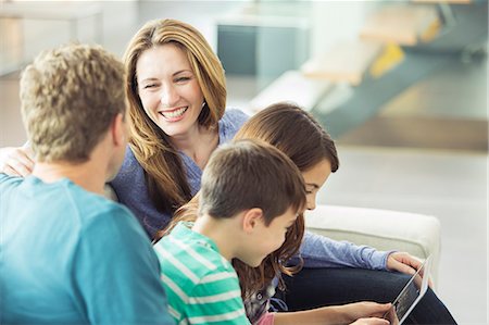 family online - Family relaxing together in living room Stock Photo - Premium Royalty-Free, Code: 6113-07730585