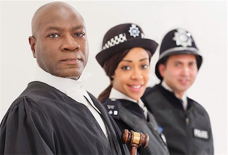 Portrait of confident judge and police Foto de stock - Sin royalties Premium, Código: 6113-07730621