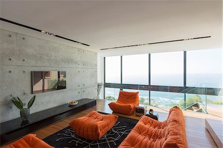 Sofas and ottoman in modern living room Photographie de stock - Premium Libres de Droits, Code: 6113-07730774