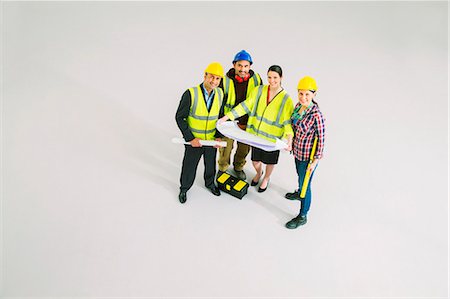 silhouette working - Portrait of confident construction workers with blueprints Stock Photo - Premium Royalty-Free, Code: 6113-07730728