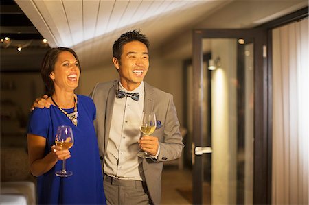 Couple laughing together at party Photographie de stock - Premium Libres de Droits, Code: 6113-07730992