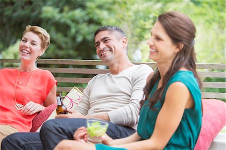 Friends relaxing together outdoors Stock Photo - Premium Royalty-Free, Code: 6113-07730996