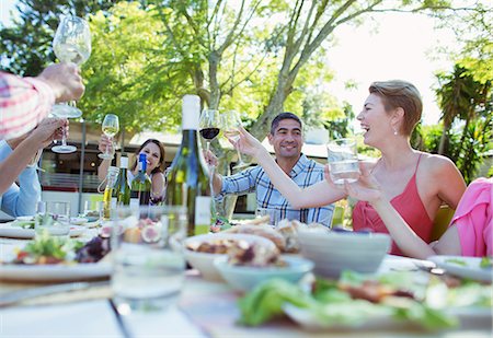 party drinks - Friends toasting each other at party Stock Photo - Premium Royalty-Free, Code: 6113-07730904