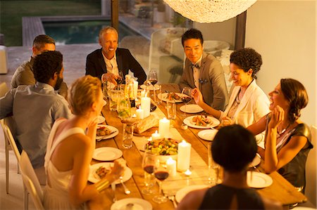 feta - Friends eating together at dinner party Photographie de stock - Premium Libres de Droits, Code: 6113-07730916