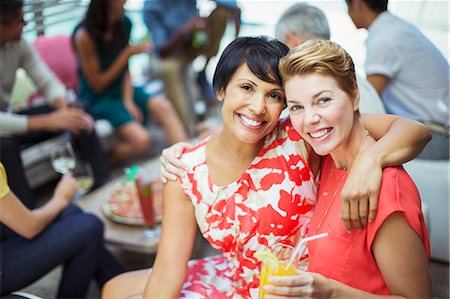 same sex couple (female) - Women hugging at party Stock Photo - Premium Royalty-Free, Code: 6113-07730924