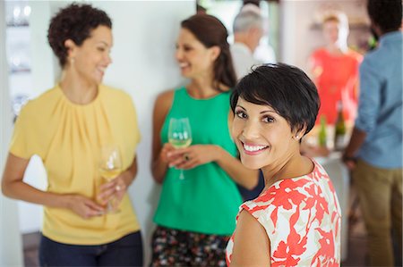 people and drinks - Woman smiling at party Stock Photo - Premium Royalty-Free, Code: 6113-07731026