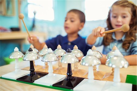 Students playing bells in class Stock Photo - Premium Royalty-Free, Code: 6113-07731152