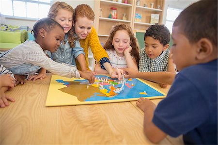 daycare - Children and teacher playing in class Stock Photo - Premium Royalty-Free, Code: 6113-07731161