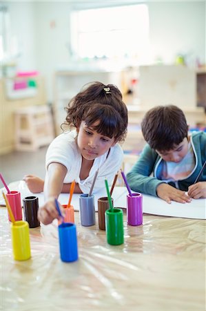 Students painting in classroom Stock Photo - Premium Royalty-Free, Code: 6113-07731191