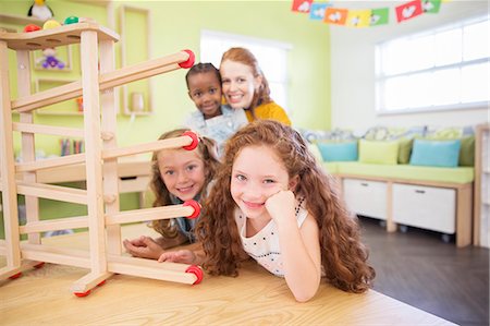 daycare - Students and teacher using model in classroom Stock Photo - Premium Royalty-Free, Code: 6113-07731199