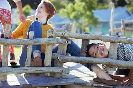 Teacher and students playing on play structure Stock Photo - Premium Royalty-Free, Code: 6113-07731221