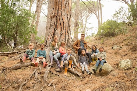 simsearch:6113-07731271,k - Students and teachers smiling in forest Stock Photo - Premium Royalty-Free, Code: 6113-07731236