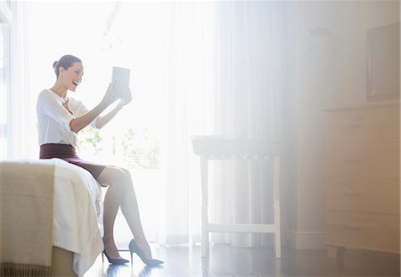 Businesswoman using digital tablet in hotel room Fotografie stock - Premium Royalty-Free, Codice: 6113-07731657