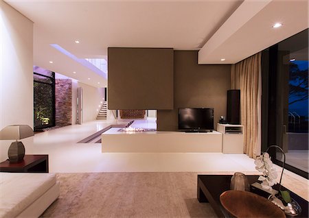 fireplace - View of fireplace in luxurious living room during night Stock Photo - Premium Royalty-Free, Code: 6113-07808247