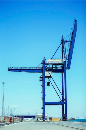 Cargo crane at waterfront Stock Photo - Premium Royalty-Free, Code: 6113-07808368