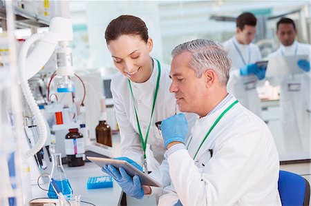 scientist tablet lab - Scientists using tablet computer in laboratory Stock Photo - Premium Royalty-Free, Code: 6113-07808454