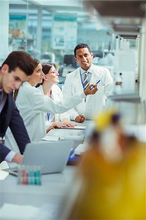 scientist laptop - Scientists talking in laboratory Stock Photo - Premium Royalty-Free, Code: 6113-07808512