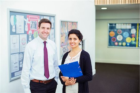 simsearch:6109-07497575,k - Portrait of tow smiling teachers standing in school corridor Foto de stock - Sin royalties Premium, Código: 6113-07808749