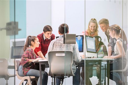 Students working with computers behind glass door Stock Photo - Premium Royalty-Free, Code: 6113-07808750