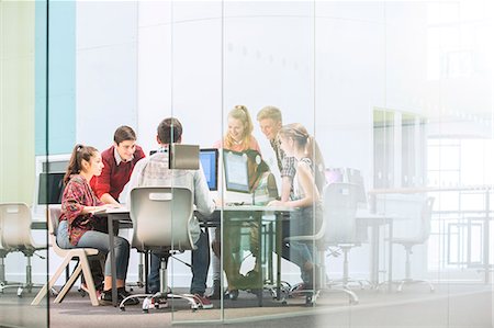 simsearch:6113-07808744,k - Students working with computers behind glass door Stock Photo - Premium Royalty-Free, Code: 6113-07808760