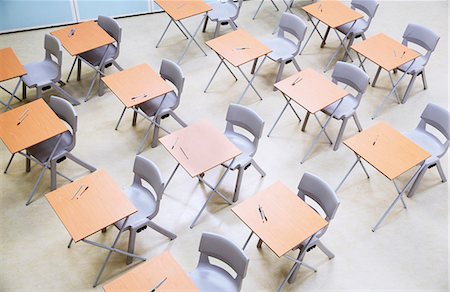 empty chairs in rows - Elevated view of rows of desks and chairs in empty classroom Stock Photo - Premium Royalty-Free, Code: 6113-07808722