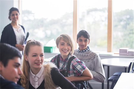 smiling student in classroom - Cheerful high school students with their teacher in classroom Stock Photo - Premium Royalty-Free, Code: 6113-07808737