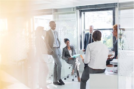 socio - Smiling business people having meeting in modern in office Foto de stock - Sin royalties Premium, Código: 6113-07808843