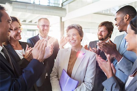 Office team congratulating businesswoman Foto de stock - Sin royalties Premium, Código: 6113-07808853