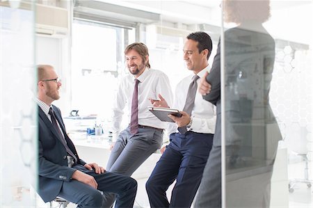 simsearch:6113-07808825,k - Businesspeople having meeting in modern office Stock Photo - Premium Royalty-Free, Code: 6113-07808893